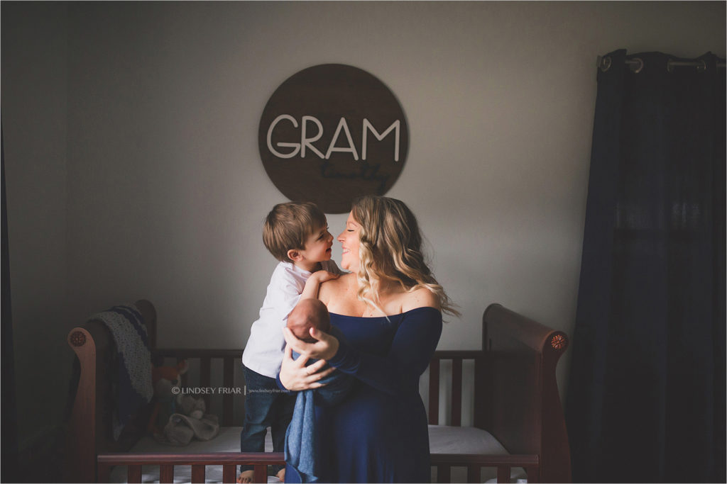 mama and son with newborn