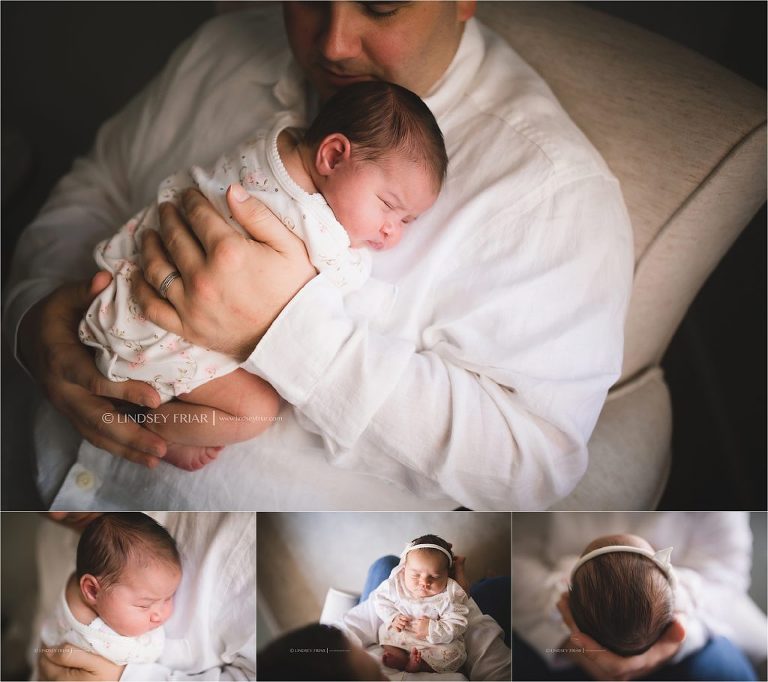 Daddy holding his newborn girl