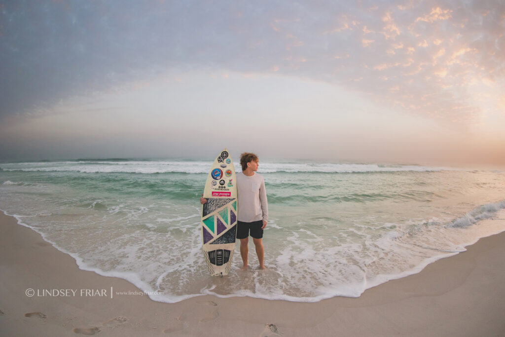 standing with a surfboard