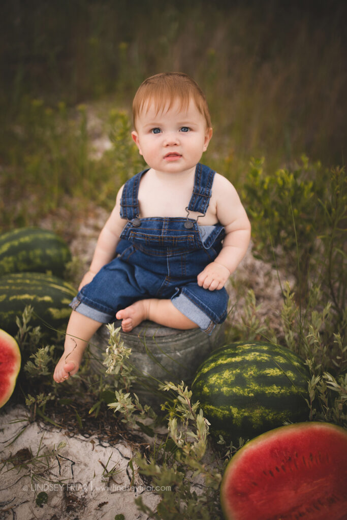 boy sitting with some watermelon