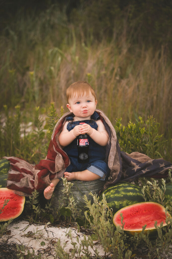 boy sitting with some watermelon