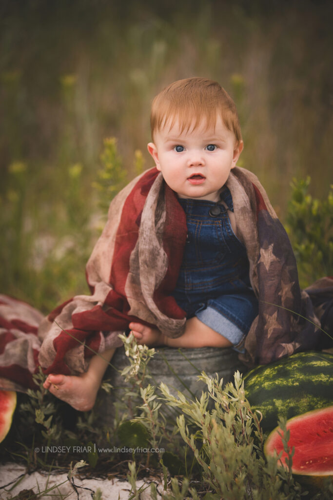 boy sitting with some watermelon