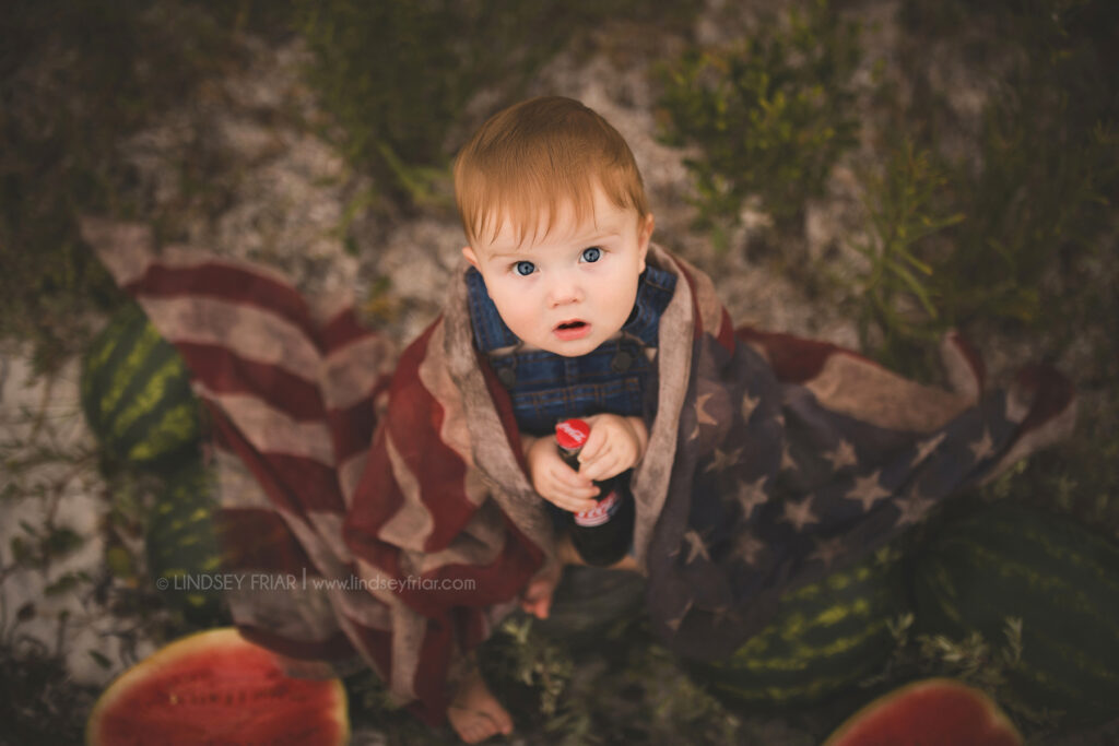 boy sitting with some watermelon